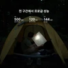 오라이트 Perun 3 Mini 헤드랜턴을 착용하고 야간 캠핑 텐트 안에서 지도를 비추며 탐색하는 모습